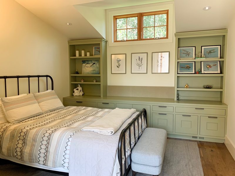 Upstairs bedroom with sage green built-ins